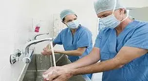 Nurse performing hand hygiene procedure in hospital