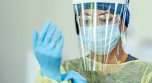 Healthcare worker wearing PPE during infection prevention training