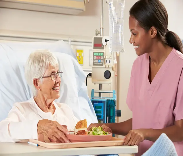 Nurse preparing a nutritious meal tray for a dependent patient