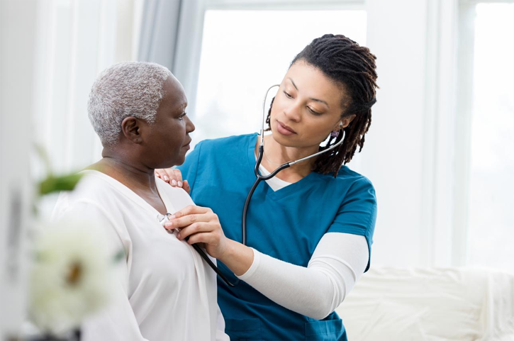 Nurse performing lung auscultation using a stethoscope during respiratory assessment